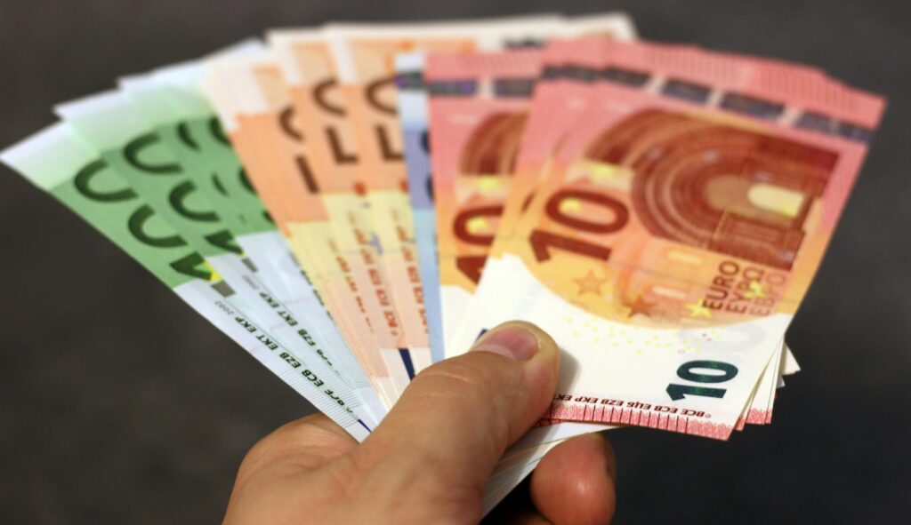 pexels-photo-259251-259251 A fan of euro banknotes in various denominations held in a hand.